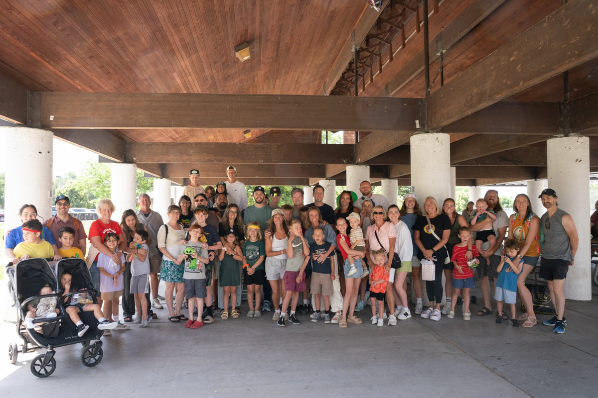 Special-needs families gathered together under a park pavilion to celebrate Theo's birthday with Pure Living Family